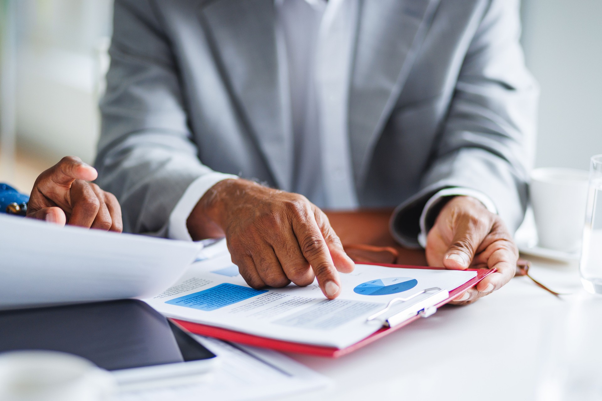 Business Executives Examining Financial Reports at Office